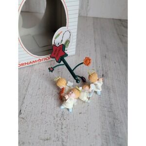 Noma Vintage baby Angel carousel ornament Xmas cherub